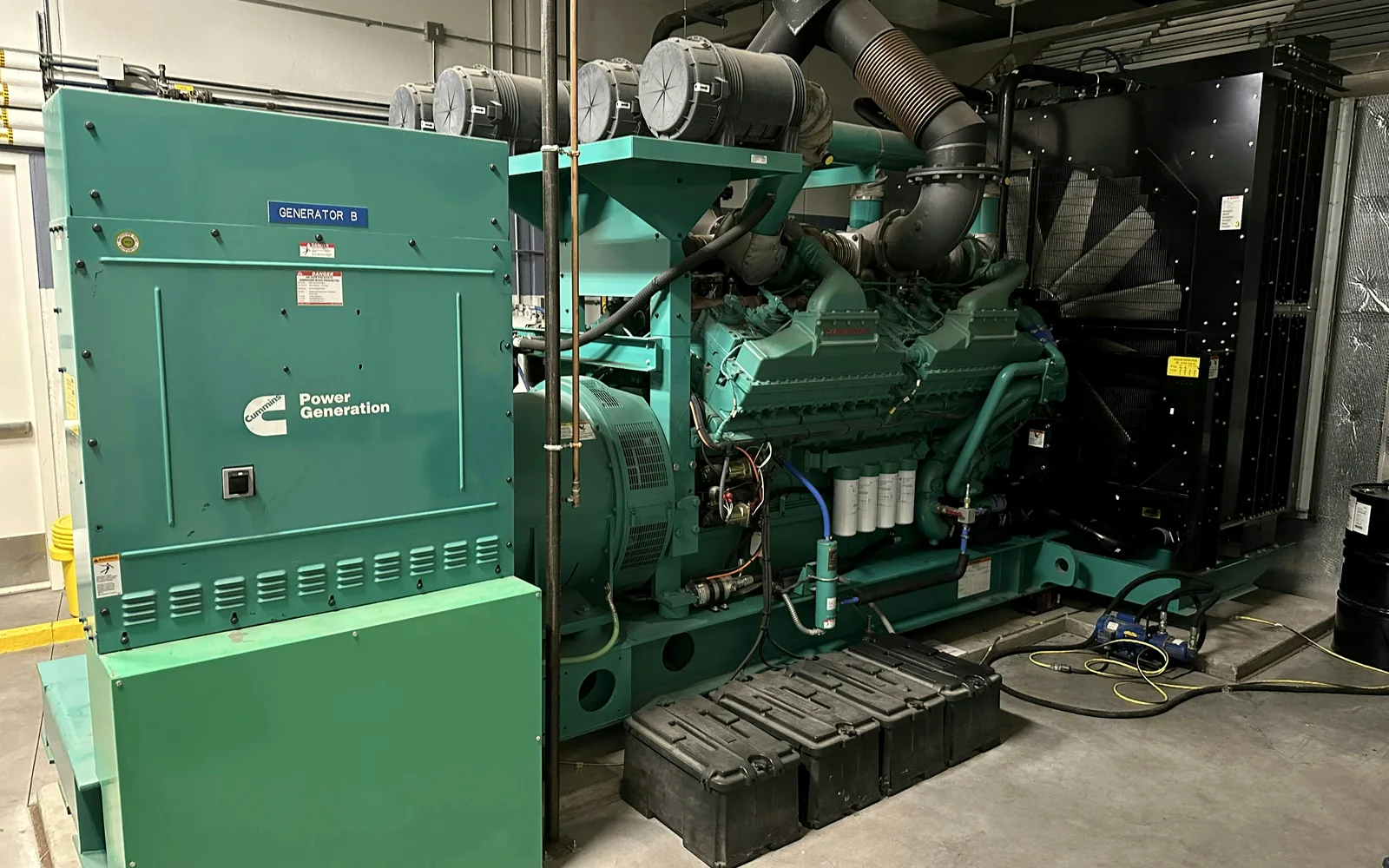 Industrial standby generator installation representing MEC power systems